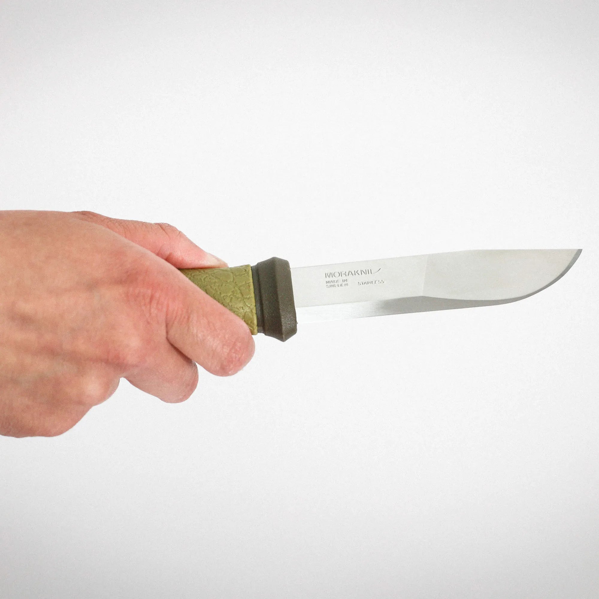 Mora_2000_Green_Knife_Hand